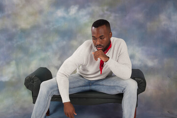 Handsome Black man  sitting thoughtfully