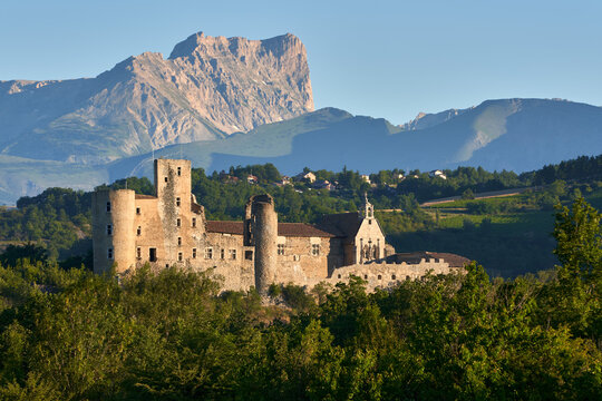 Tallard, Hautes-Alpes, 05000, France - July 05, 2020: Tallard Castle ruins (Medieval Historic Monument) in the Durance Valley with Bure Peak in the distance