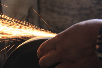 Sparks grinding wheel while knife sharpening