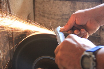 Sparks grinding wheel while knife sharpening