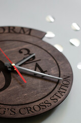 Wooden clock on a grey background