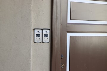 Wooden door. Outdoor Video Intercom Door Station on the wooden wall. Built-in IC card reader. Selective focus