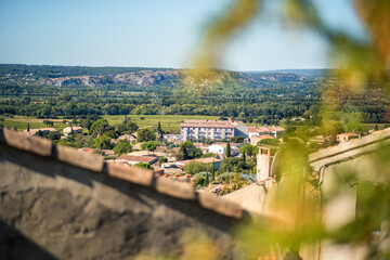 Panoramic of Provence hills seen from village of Chateauneuf-du-Pape, with roofs, trees, blue sky and sunny day. In Vaucluse department, Provence, France, travel tourism destination