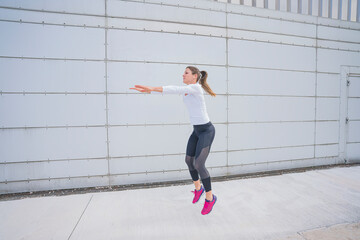 Athletic woman training in the urban area.