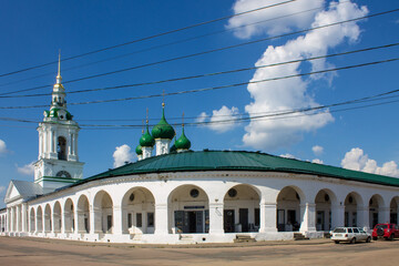 white stone Red rows with columns in the old city of Kostroma Russia on a clear summer day and...
