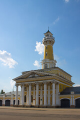 Fototapeta na wymiar Fire tower in the historical part of the Kostroma Russia on a clear summer day and space for copying