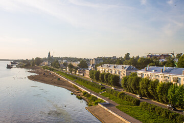 Fototapeta na wymiar Panoramic view of the embankment and the city beach of Kostroma on the Volga river Russia on a summer evening and space for copying
