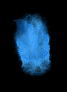 Freeze motion of blue powder exploding, isolated on black. Abstract design of white dust cloud. Particles explosion screen saver, wallpaper with copy space. Planet creation concept