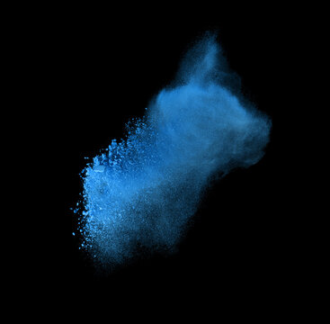 Freeze motion of blue powder exploding, isolated on black. Abstract design of white dust cloud. Particles explosion screen saver, wallpaper with copy space. Planet creation concept