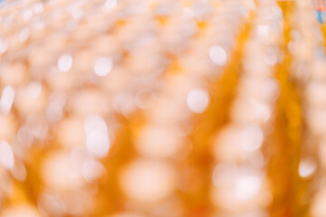 Abstract orange gold and yellow color bokeh blur background with copy