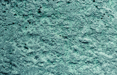 Background. The texture of concrete is blue. Rough colorful surface.