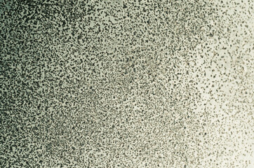 Metal texture in grey color in small dots. Background.