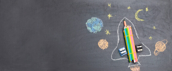 Banner Back to school with a rocket made from pencils on a school board, flatley, copyspace