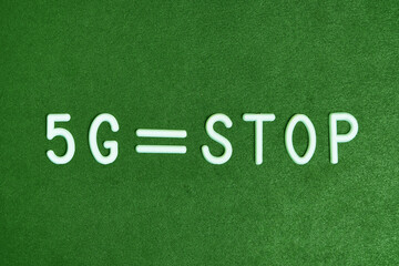 5G technology, stop progress, technology progress concept on a green background.