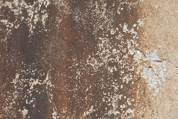 Brown stripped concrete wall texture with cracks and scratches. Fragment of old castle wall, for background or texture.