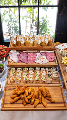 Tasty sausage snack, garnish on the wooden plate