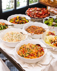 Different salads on the white table