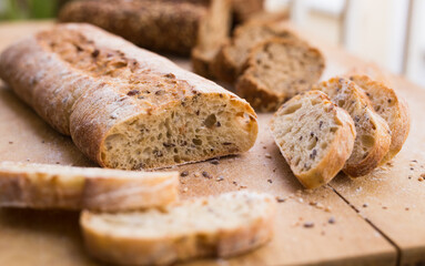fresh loaf of bread on wooden board