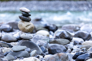 Fototapeta na wymiar stack of stones near a river