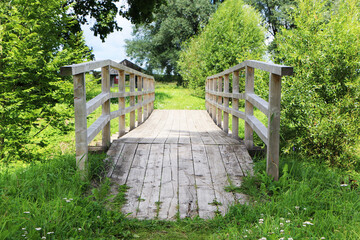Old vintage wooden footbridge. The architecture is an old wooden bridge.