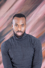 Obraz premium Handsome Black man looking Pensive in a grey shirt