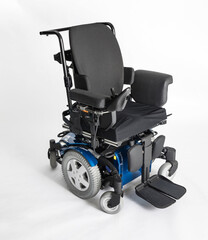 Empty electric wheel chair on white background © Risal
