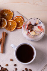 espresso in a cup and milky desert with fruit