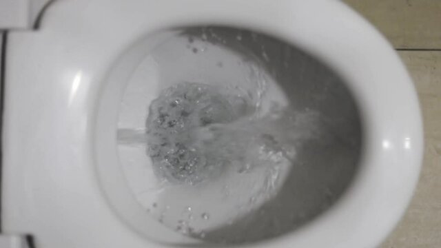 top view of the flushing water in the toilet