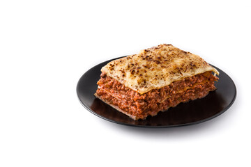 Piece of meat lasagna on black plate isolated on white background. Copy space