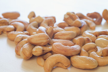 Roasted Cashew nuts  on the wood floor background,close up