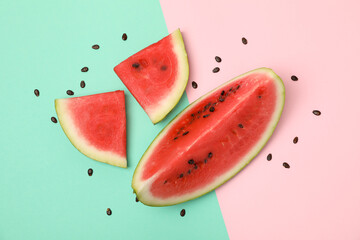 Composition with watermelon slices on two tone background, top view