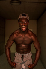 Obraz na płótnie Canvas Athletic black man during the training.