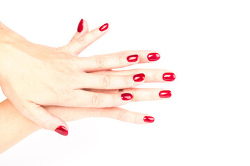 Stylish trendy female manicure. red manicure nails on white background