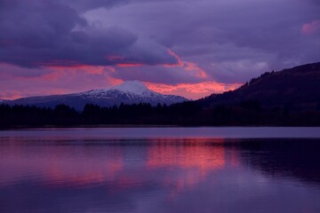 Sunset over Lake of Menteith showing a snow capped Ben Lomond.