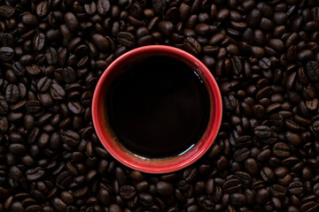 close up of coffee beans and a coffee cup, hot drink beverage concept