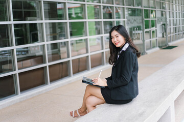 Beautiful young asian woman  holding tablet pc