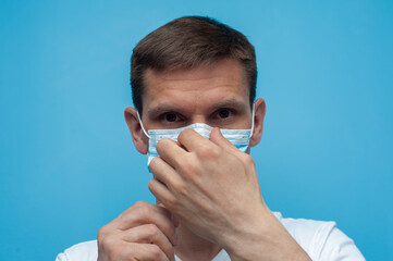 Portrait of man wearing an anti virus protection mask to prevent corona virus.
