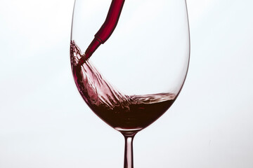 Glass of red wine on white background