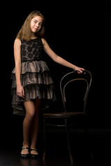 Obraz na płótnie Canvas Beautiful young teen girl studio photo on black background
