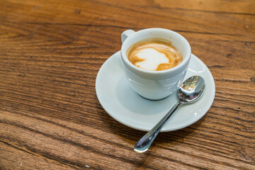 Traditional Italian espresso coffee on wooden table