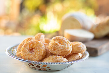 Cafe table with breads, crackers and accessories with blurred background, natural light on white table, selective focus