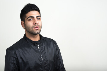 Fototapeta premium Portrait of young handsome bearded Indian man