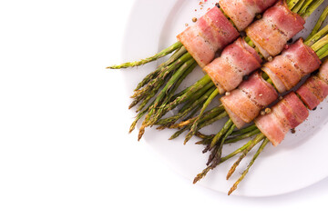 Green asparagus wrapped with bacon isolated on white background.Top view. Copy space