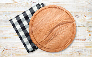Empty pizza board and napkin isolated on white.