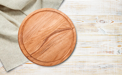 Empty pizza board and napkin isolated on white.