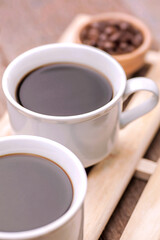 Two Cups of Hot Black Coffee