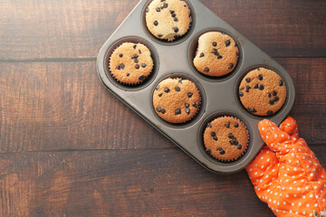Top view of women hand holding chocolate pan cake.