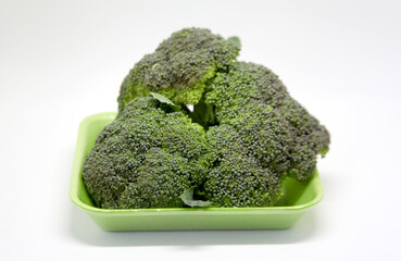 Broccoli, a vegetable with leaves, flowers and edible floral peduncles, widely used in world cuisine in salads and other dishes. It has many nutritional components