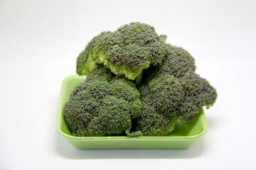 Broccoli, a vegetable with leaves, flowers and edible floral peduncles, widely used in world cuisine in salads and other dishes. It has many nutritional components
