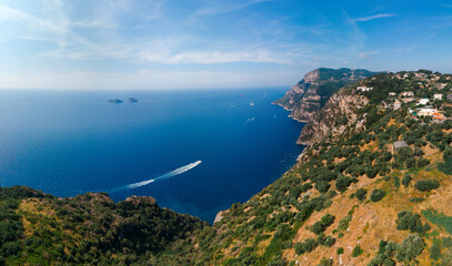 Fototapeta na wymiar San Pietro viewpoint. the boat is moving. Beautiful road to Positano, Amalfi, Salerno. Aerial view Italy mountains, sea. Travel tour concept, Summer sunny day, Vacation. Nature. Copy space